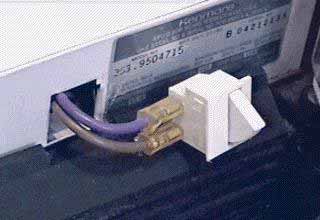 Pull the door switch out far enough to remove the wires